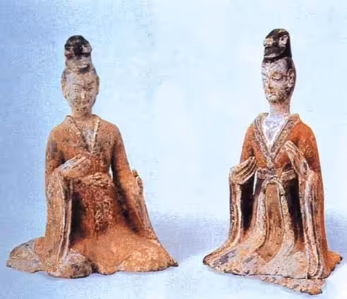 Musician dressed in a Ruqun (blouse-and-skirt ensemble) — Northern Dynasties pottery figurine (extant artifact).